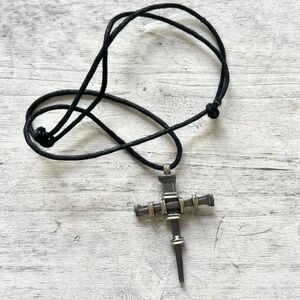 Hematite  nail stake cross on cord
